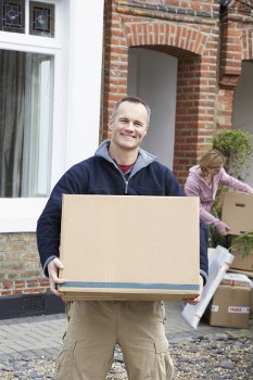 Professional flat removals planning in Brixton with packed boxes and moving tools